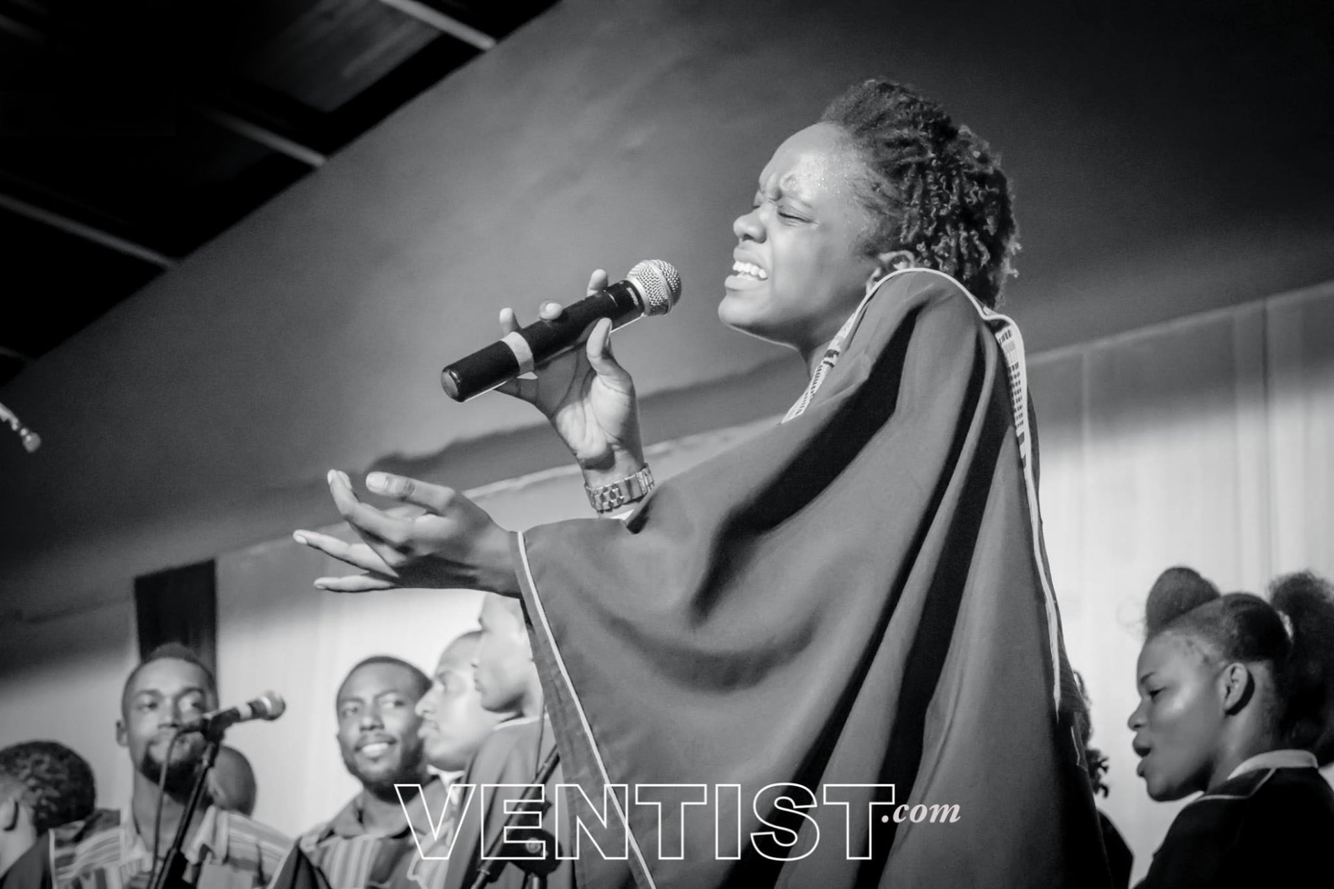 Lead vocalist worshiping with the choir
